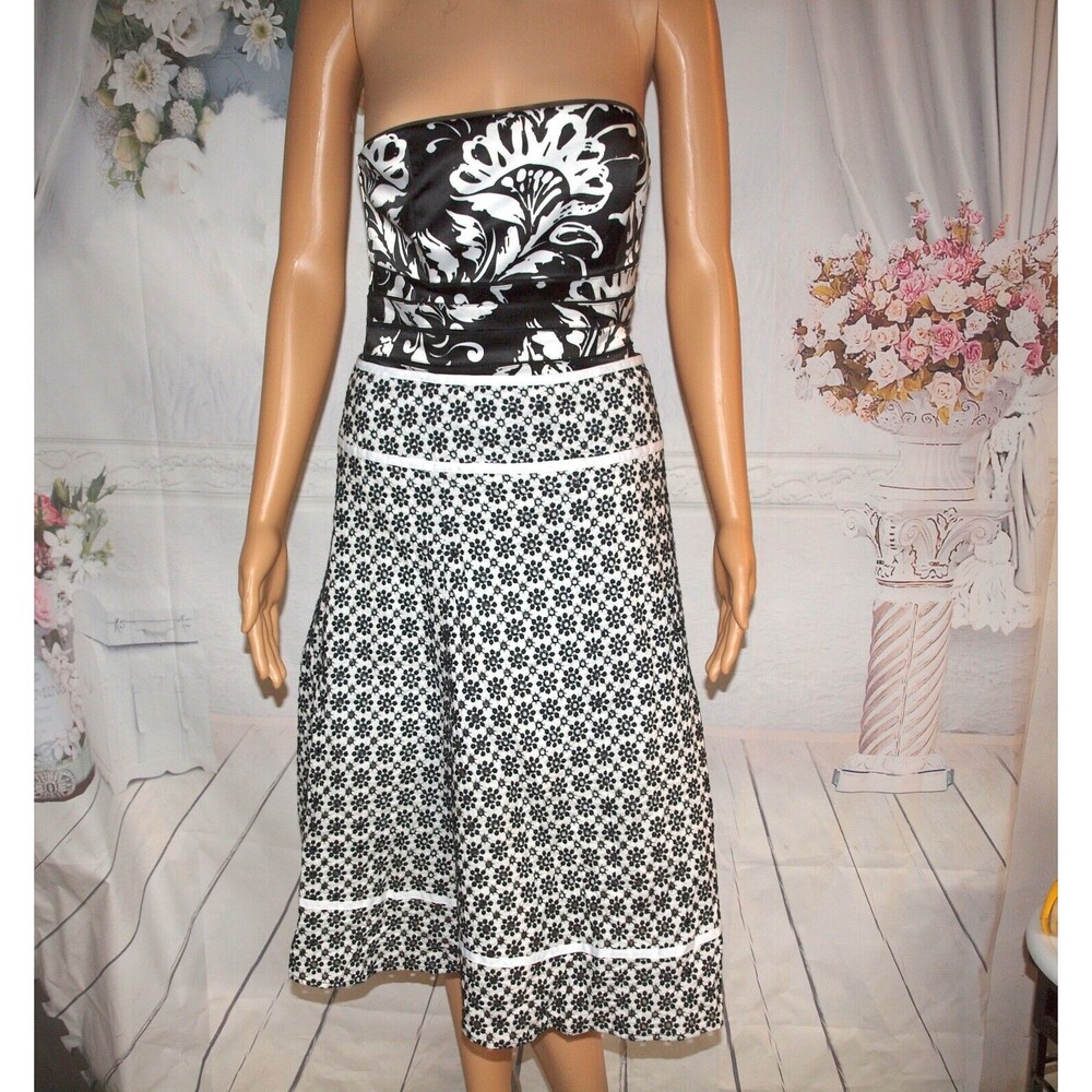New York & Company woman's black dot pattern 2 layered has a lining size 10